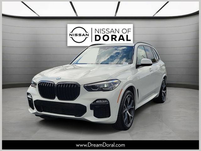 2021 BMW X5 sDrive40i in Alpine White — front three-quarter view
